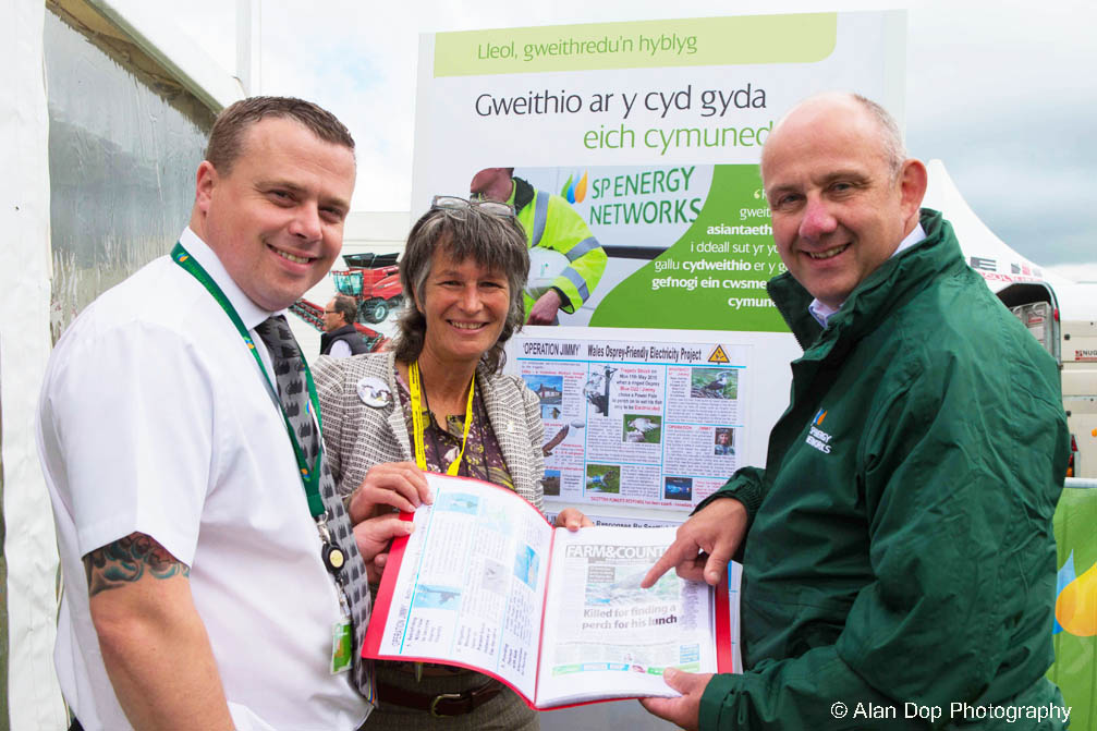Gail with 2 key managers from Scottish Power standing infront of the A3 displays at The Anglesey Show 2015